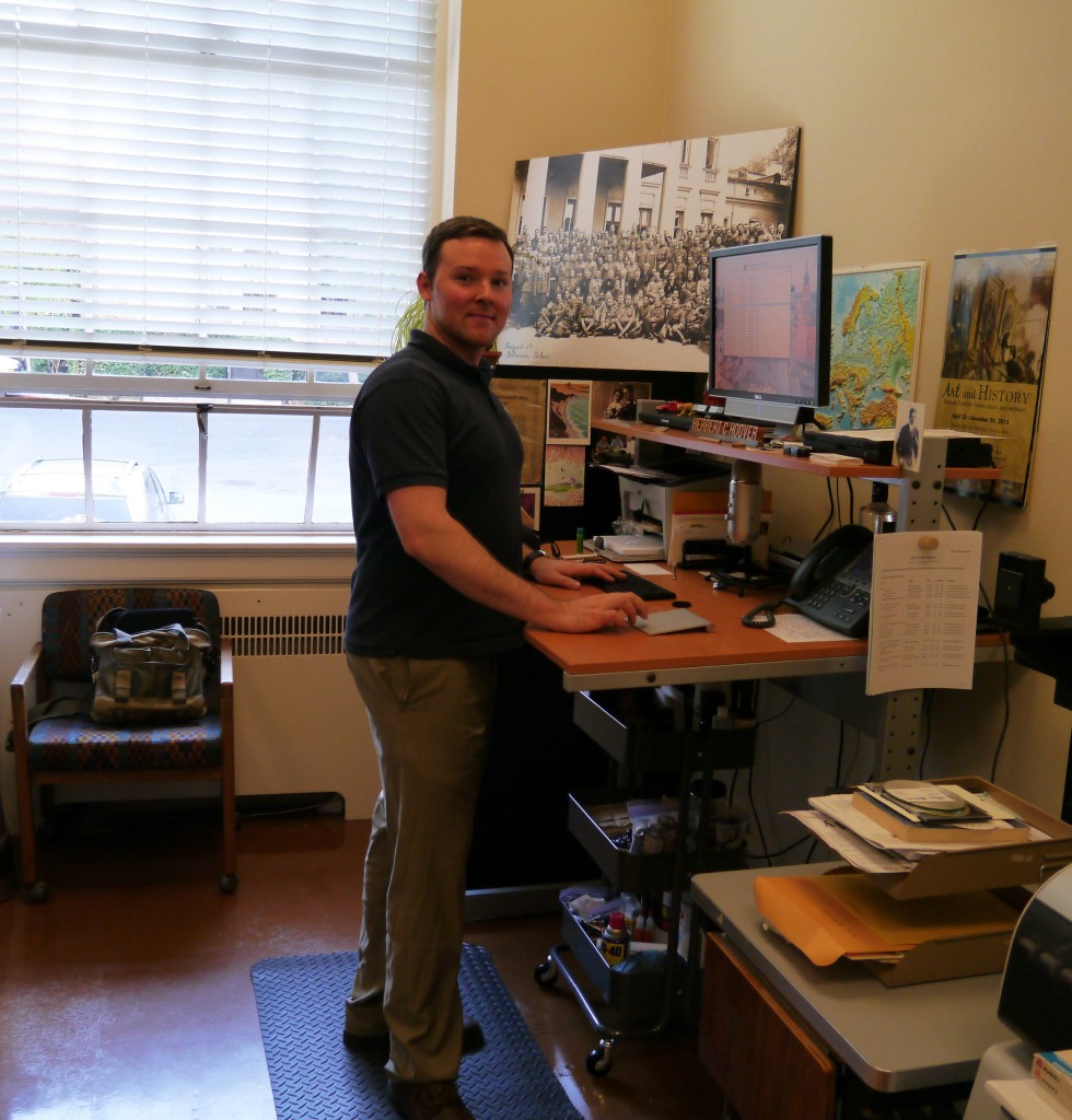 Me at my standing desk (originally a drafting table) at work.