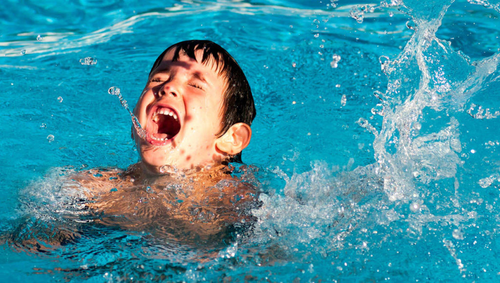 kid learning to swim